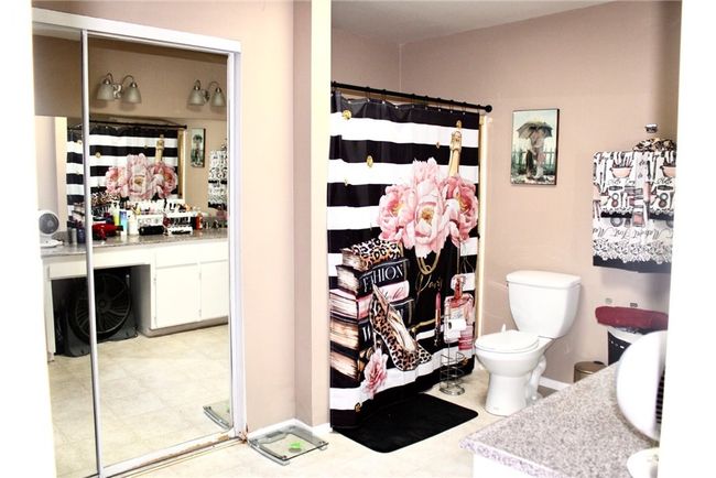 Primary bathroom has dual closets | Image 8