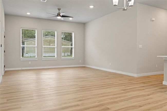 Spacious view of a stunning dining and living area, bathed in natural light—perfect for making it your new home! | Image 7