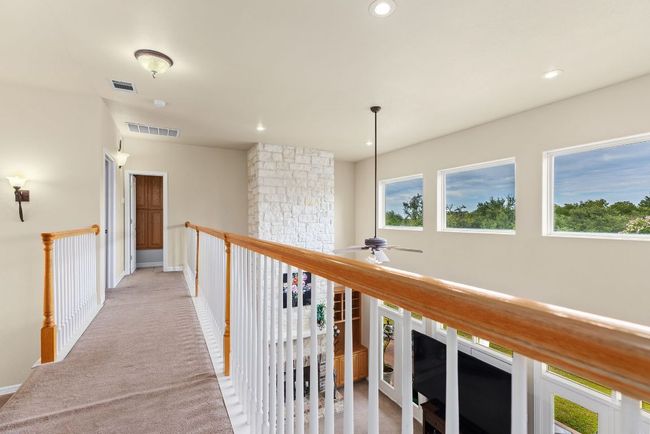 Upstairs catwalk across the living area. | Image 21