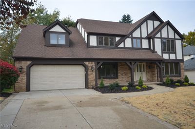 View of front facade with a garage | Image 1