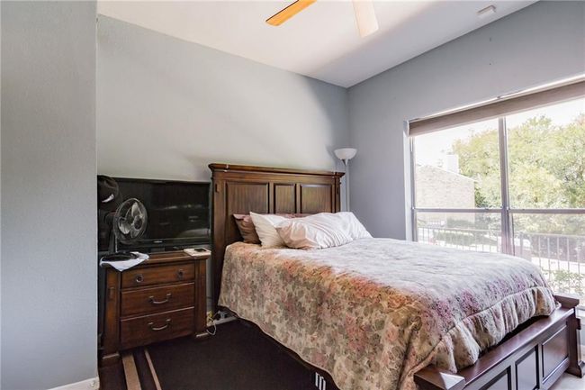 Bedroom with a ceiling fan | Image 23