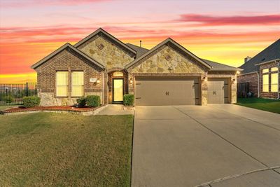 View of front of property with a yard and a garage | Image 2