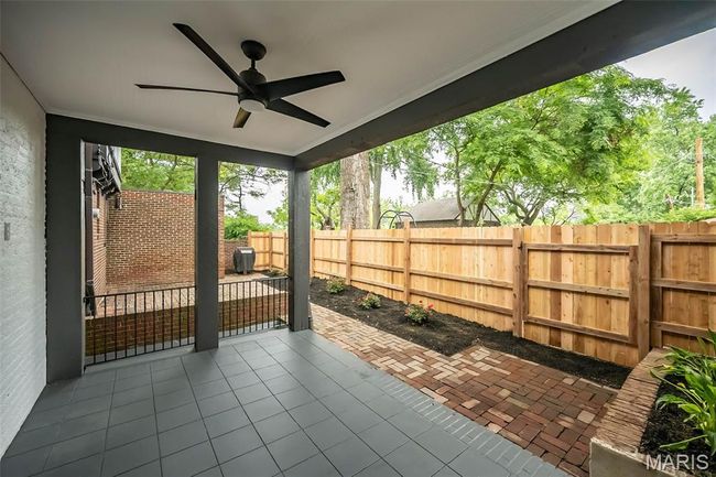 Covered patio with ceiling fan and room for your TV! | Image 28