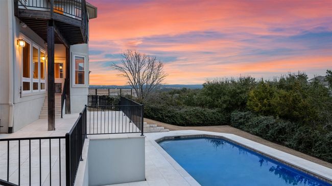 Outdoor pool featuring a balcony and a patio | Image 37