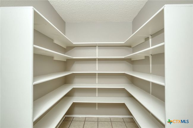 Very large pantry area with laundry area on opposite back wall | Image 16