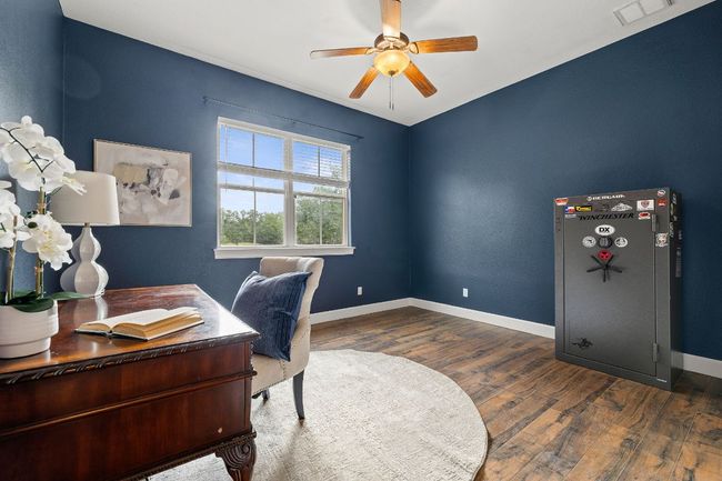 Bedroom downstairs that has been utilized as an office. | Image 13