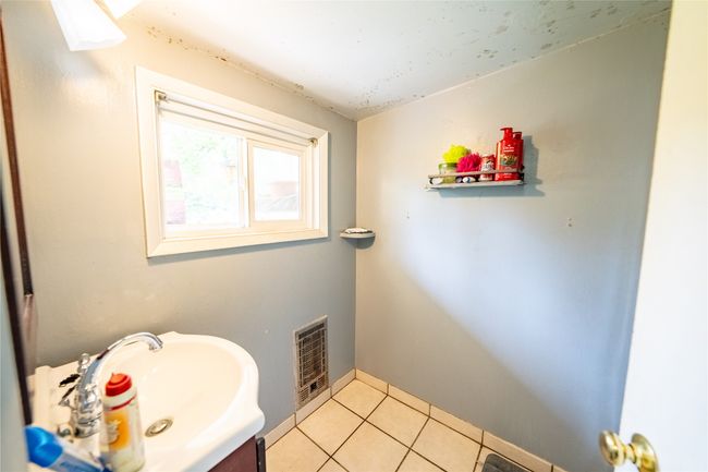Bathroom with vanity and tile patterned flooring | Image 32