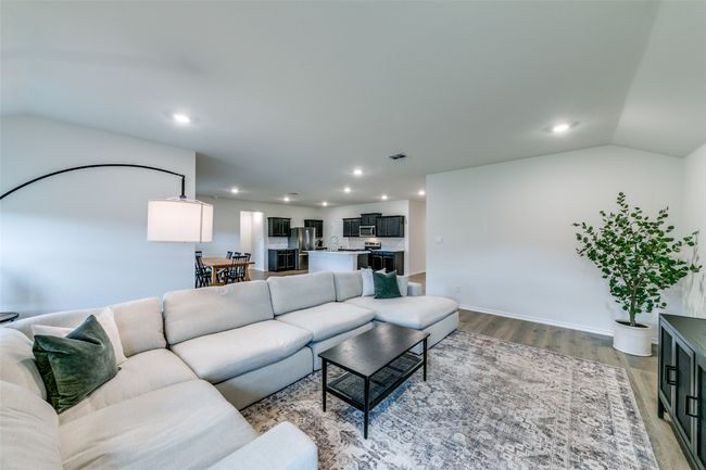 Living room with hardwood / wood-style flooring and vaulted ceiling | Image 6