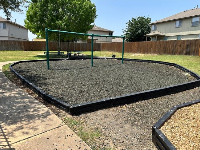 Views of the swing set and bench seating. | Image 29