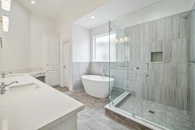 Primary Bath (17 x 19): Notice the soaker tub, and the brand new tile shower. The flooring is new. The counter tops are new and the fixtures as well. Cabinets are soft close and all hardware is satin nickel. Great clean look. | Image 2