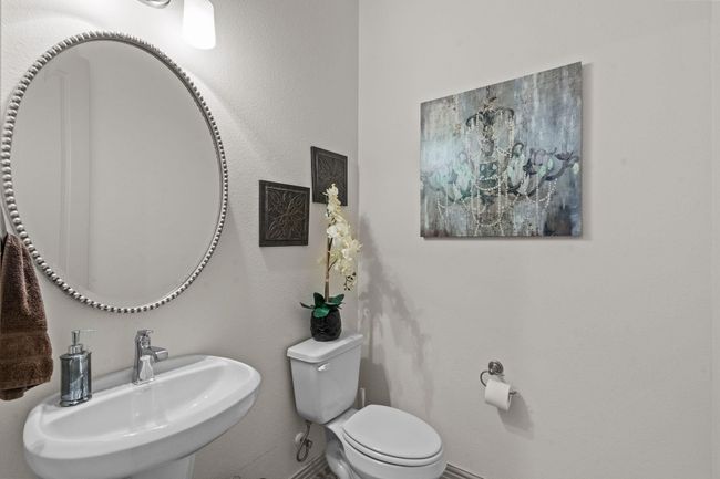 Half bath featuring toilet and a textured wall | Image 10
