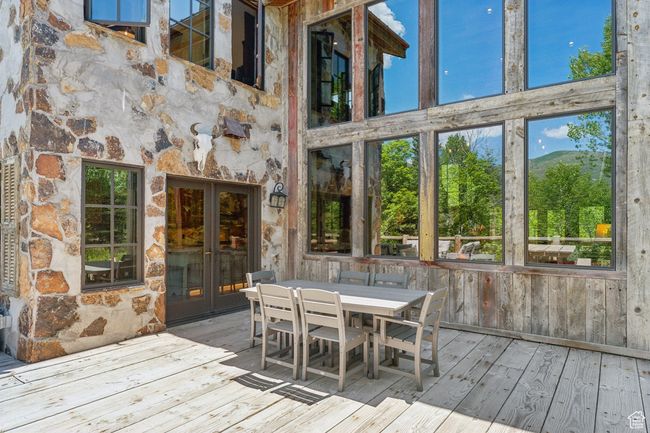 Wooden deck with french doors and outdoor dining space | Image 50