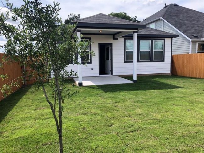 Back of property with a fenced backyard, a patio, and roof with shingles | Image 20