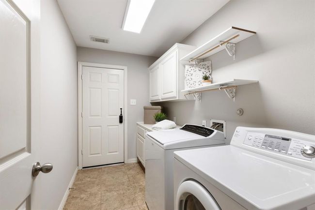 Large Laundry room with door to garage. | Image 25
