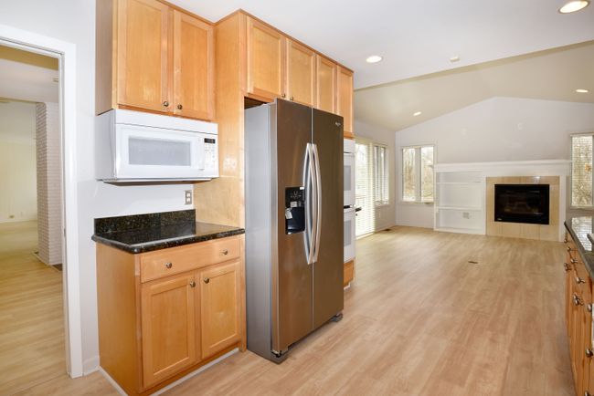 View of kitchen opening to sitting/brkfast area | Image 14