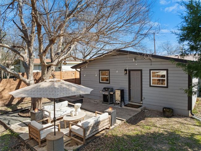 Back of house featuring an outdoor living space and a patio | Image 38