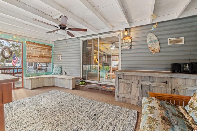 Sunroom / solarium featuring ceiling fan | Image 26