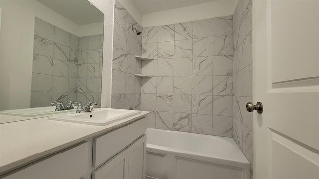Full bathroom with vanity and tub / shower combination | Image 13