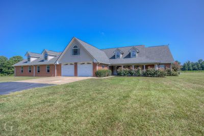 Cape cod-style house featuring a front lawn | Image 3