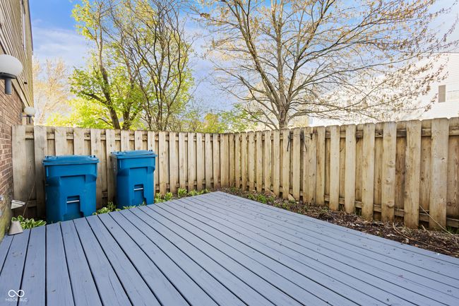 wooden terrace featuring a fenced backyard | Image 25
