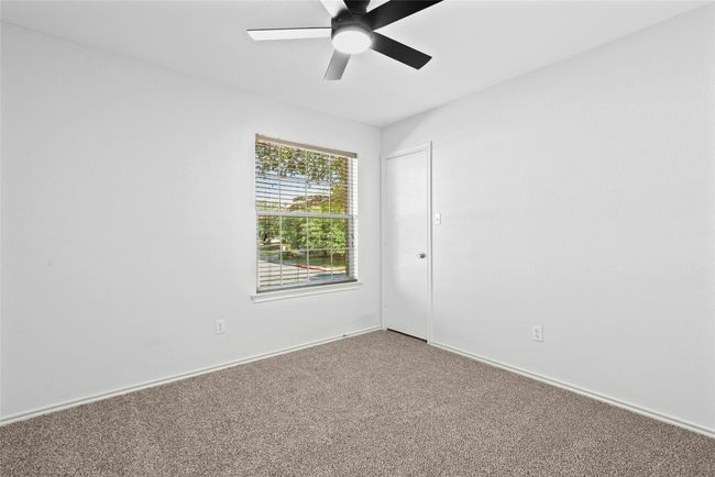 Unfurnished room with carpet flooring and a ceiling fan | Image 23