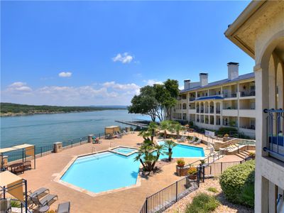 Large balcony with pool and lake view | Image 2