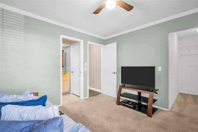 2nd bedroom conveniently offers both a walk-closet and bath access~ | Image 20