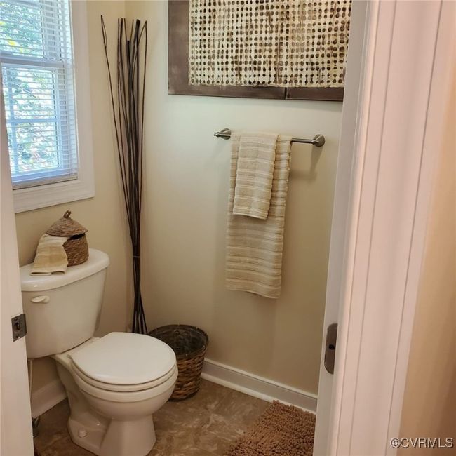 Bathroom featuring toilet and baseboards | Image 38