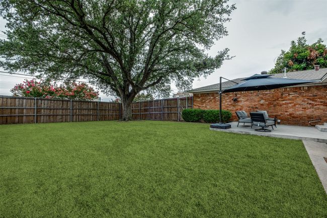 Fenced backyard featuring a patio | Image 34