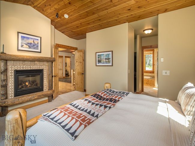 Primary suite - main floor with propane fireplace | Image 26