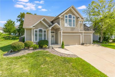 View of front of property with a garage and a front yard | Image 2