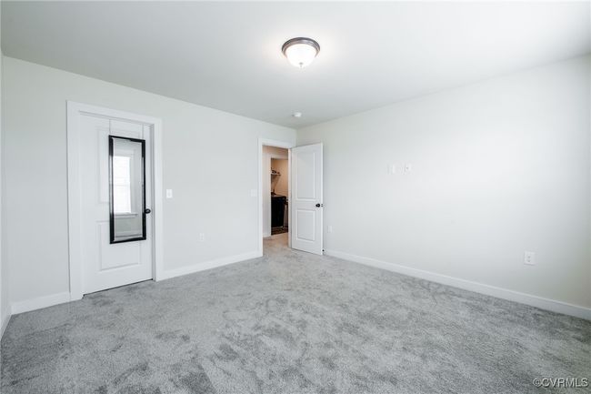 Unfurnished bedroom featuring carpet and baseboards | Image 31