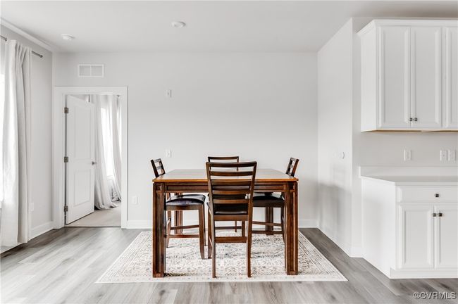 Dining area with light wood-style flooring | Image 14