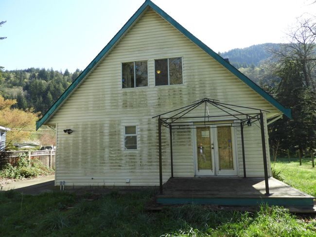 Rear view of property with french doors, a gazebo, and a deck | Image 33