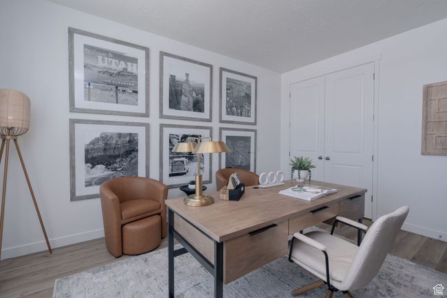 Home office featuring baseboards and wood finished floors | Image 31