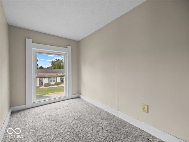 unfurnished room featuring carpet and a textured ceiling | Image 17
