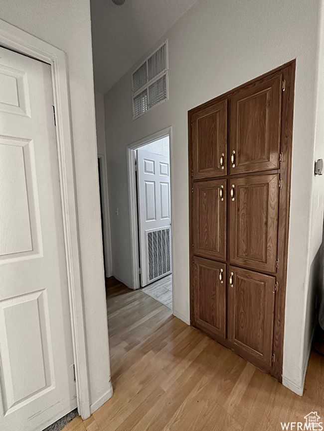 Hallway featuring light wood finished floors and visible vents | Image 25