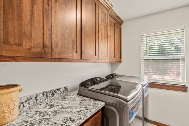 Second home utility room with full size washer and dryer | Image 16
