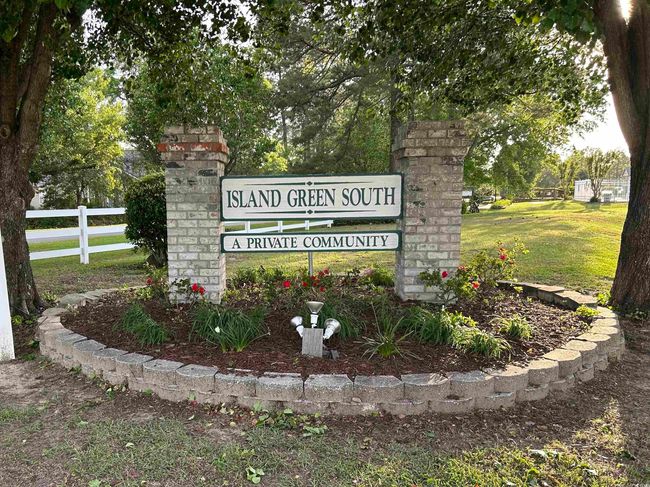 Community / neighborhood sign with a yard and fence | Image 9