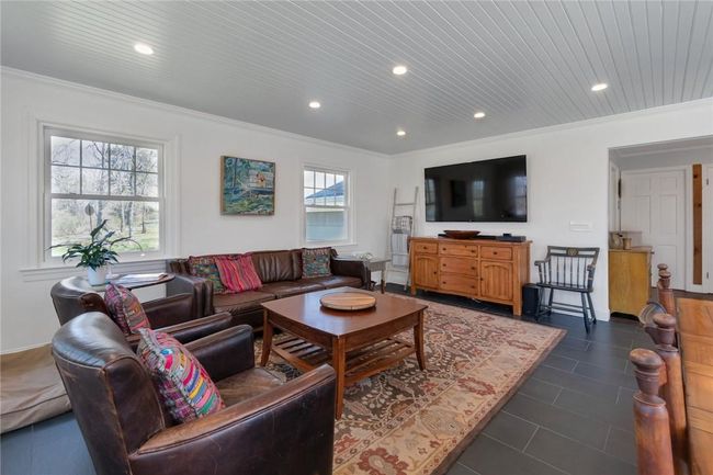 First floor family room with door out to the deck for grilling and enjoying summer nights in the hot tub. | Image 8