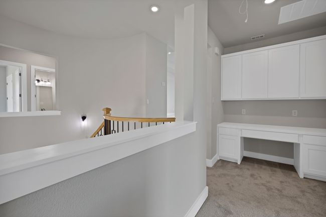 Hallway featuring light carpet, recessed lighting, and an upstairs landing | Image 34