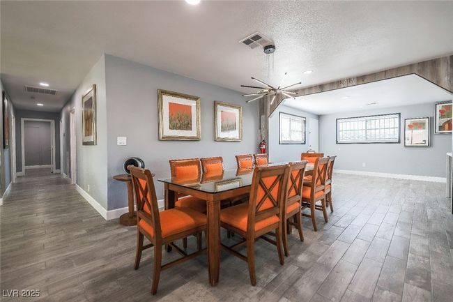 Dining space with dark wood-type flooring, baseboards, recessed lighting, and a textured ceiling | Image 19