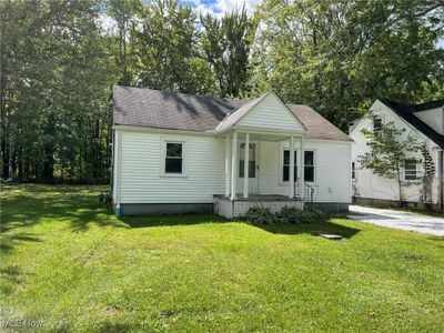 View of front facade featuring covered porch and a front lawn | Image 2