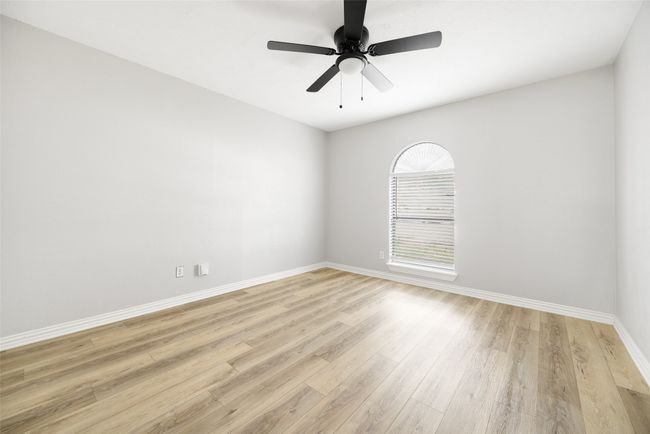 All three bedrooms with new LVP, ceiling fans and paint | Image 13