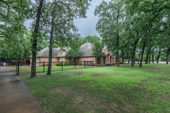 View of yard featuring a gate | Image 8