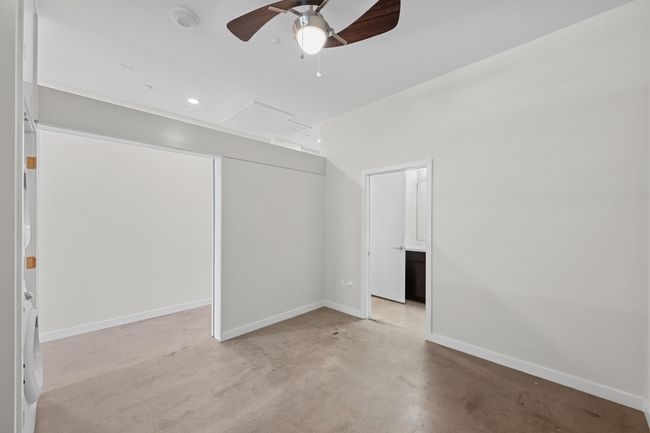 Unfurnished bedroom with baseboards, recessed lighting, concrete flooring, and ceiling fan | Image 18