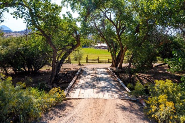 View of property's community featuring fence and a mountain view | Image 26
