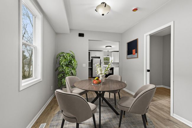 A virtually staged photo of the dining room. | Image 13