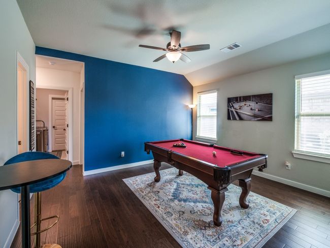 Game room featuring wood finished floors, visible vents, a ceiling fan, and billiards | Image 30