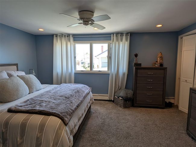 Primary bedroom featuring recessed lighting, ceiling fan and 2 closets. | Image 19